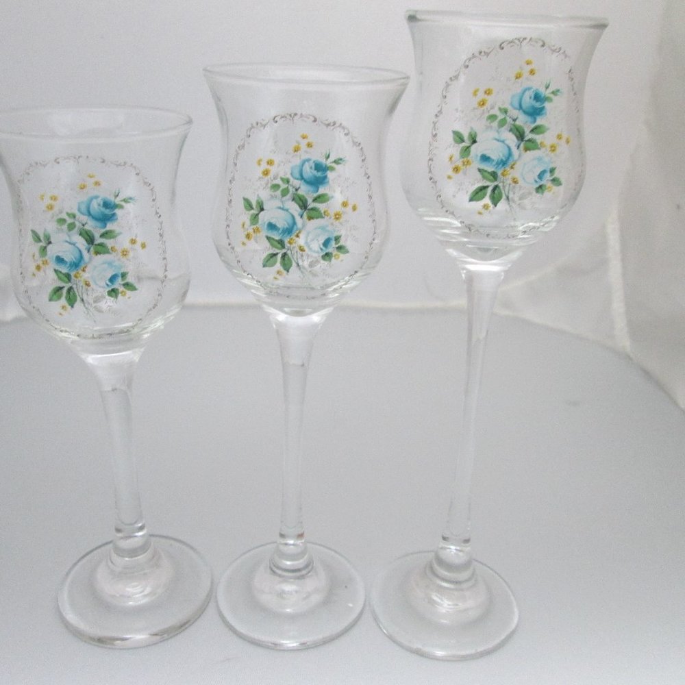 5/$30 Set of 3 stemmed candleholders blue flowers